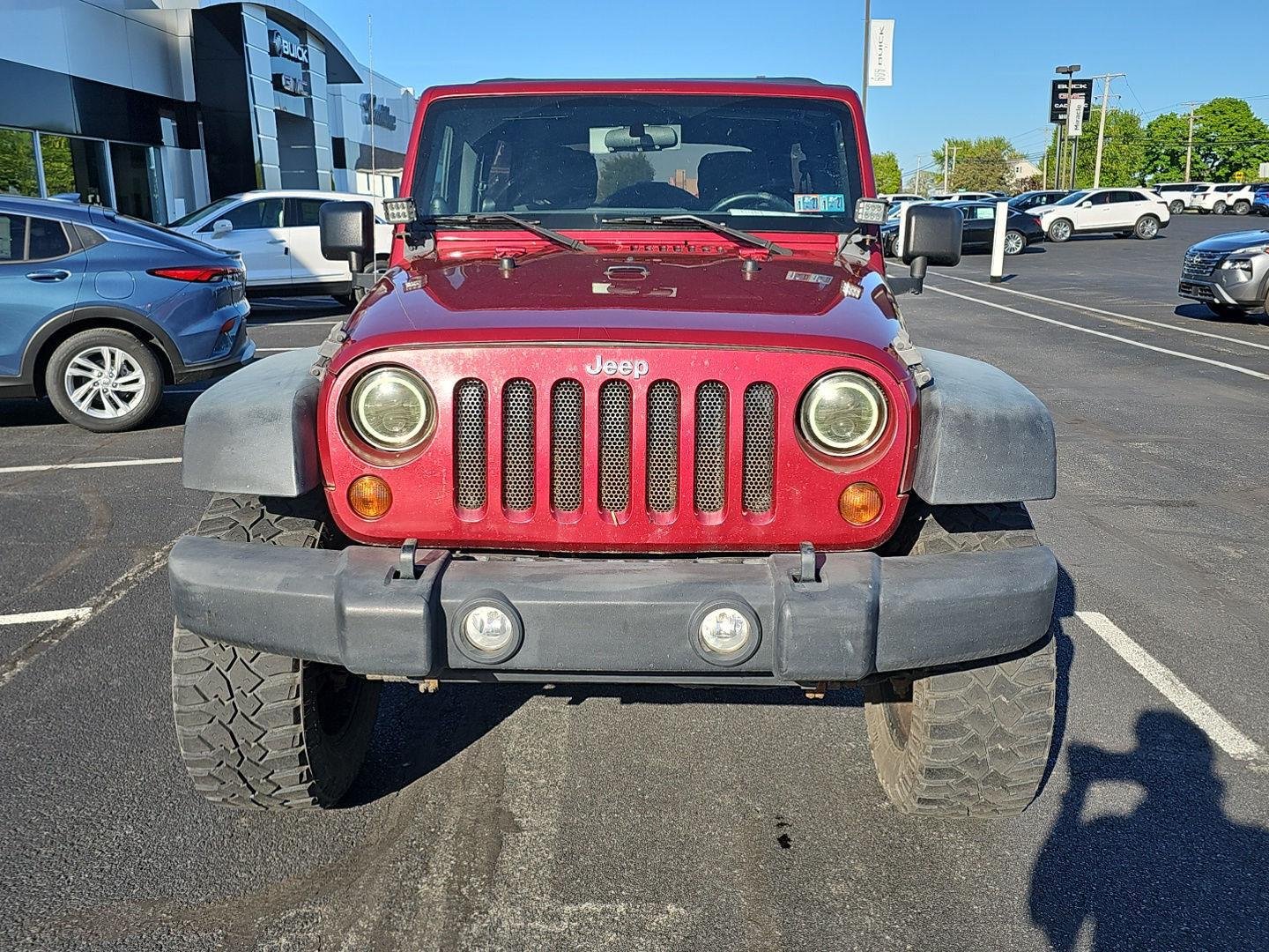 Used 2011 Deep Cherry Red Crystal Pearl Coat Jeep Sport image 5