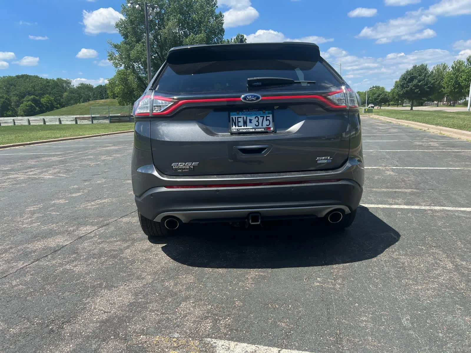 Used 2015 Magnetic Metallic Ford SEL image 6