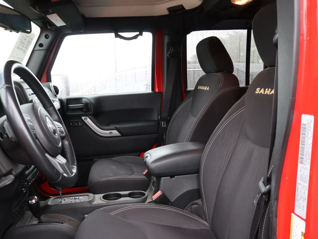 Used 2015 Red Jeep Unlimited Sahara image 11