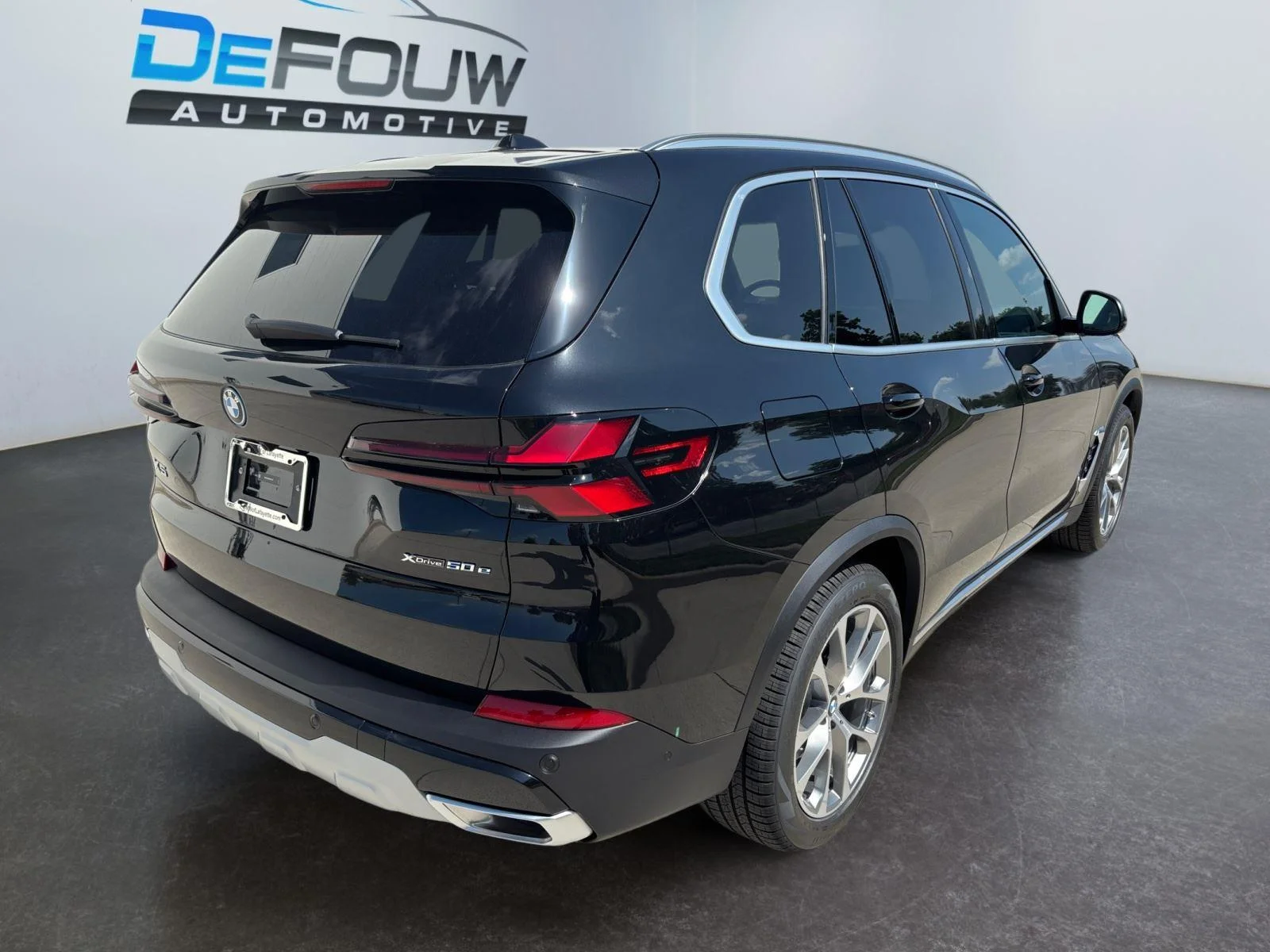 New 2026 Black Sapphire Metallic BMW xDrive50e image 13