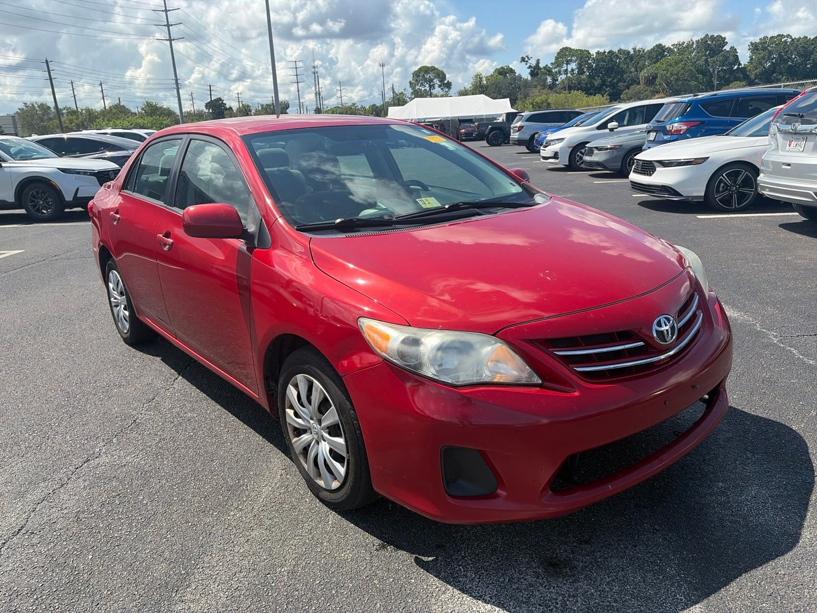 Used 2013 Red Toyota LE image 1