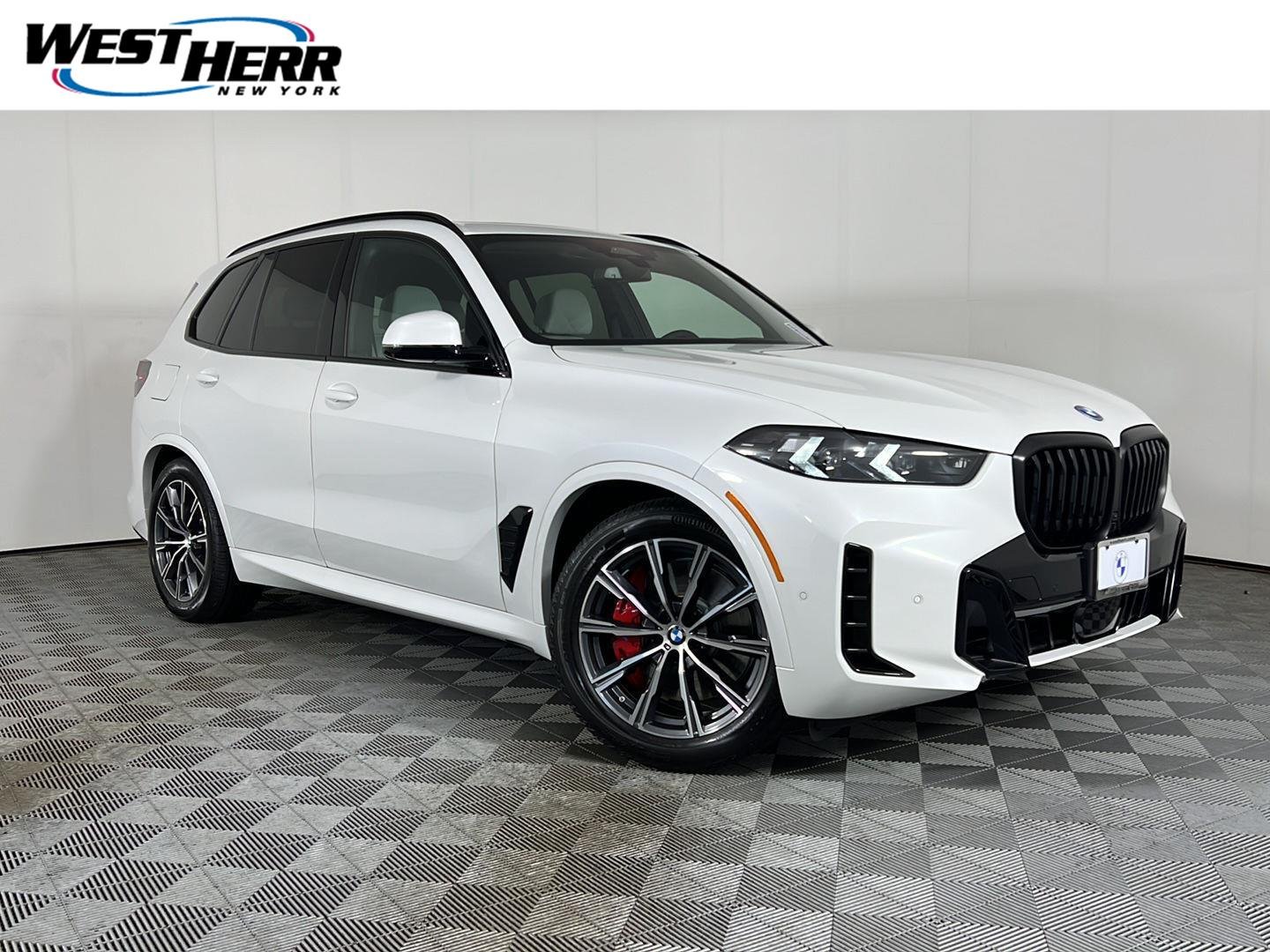 Used 2026 Mineral White Metallic BMW xDrive50e image 1