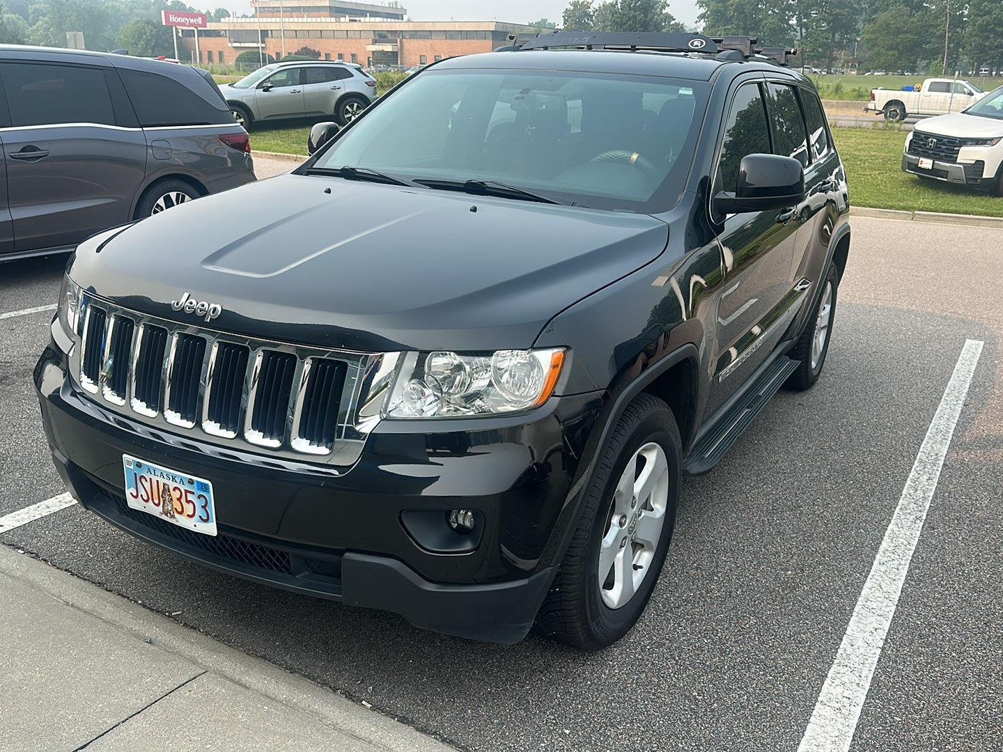 Used 2011 Brilliant Black Crystal Pearl Jeep Laredo image 1