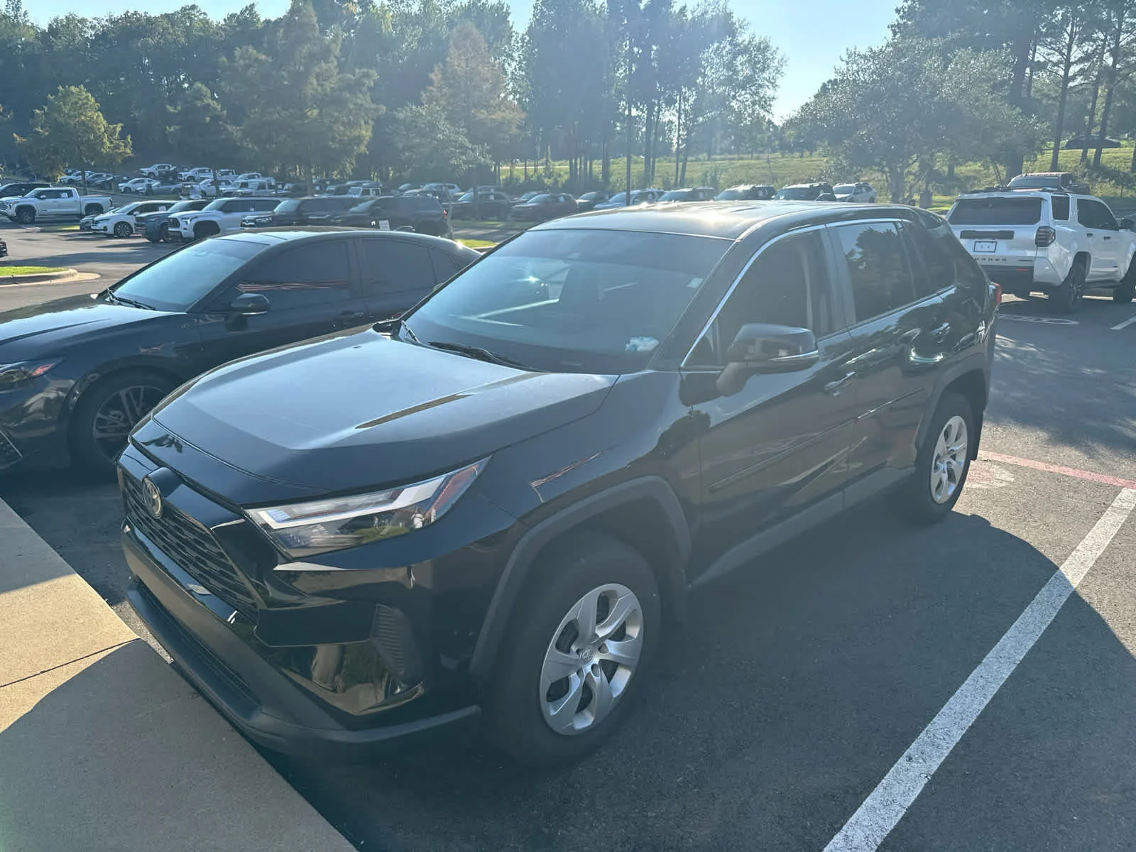 Used 2024 Midnight Black Metallic Toyota LE image 2