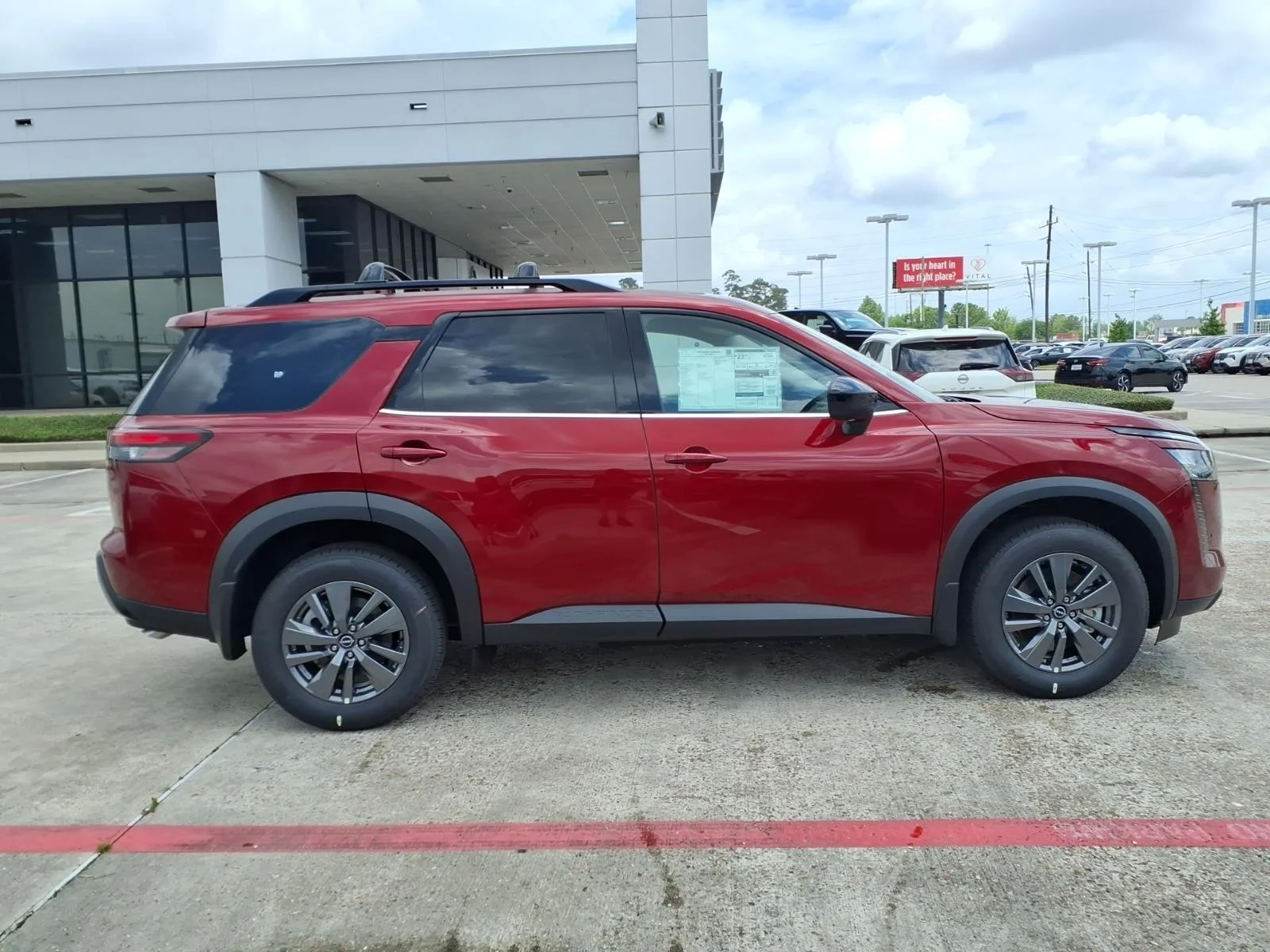 2026 Nissan Pathfinder SV Red at Robbins Nissan