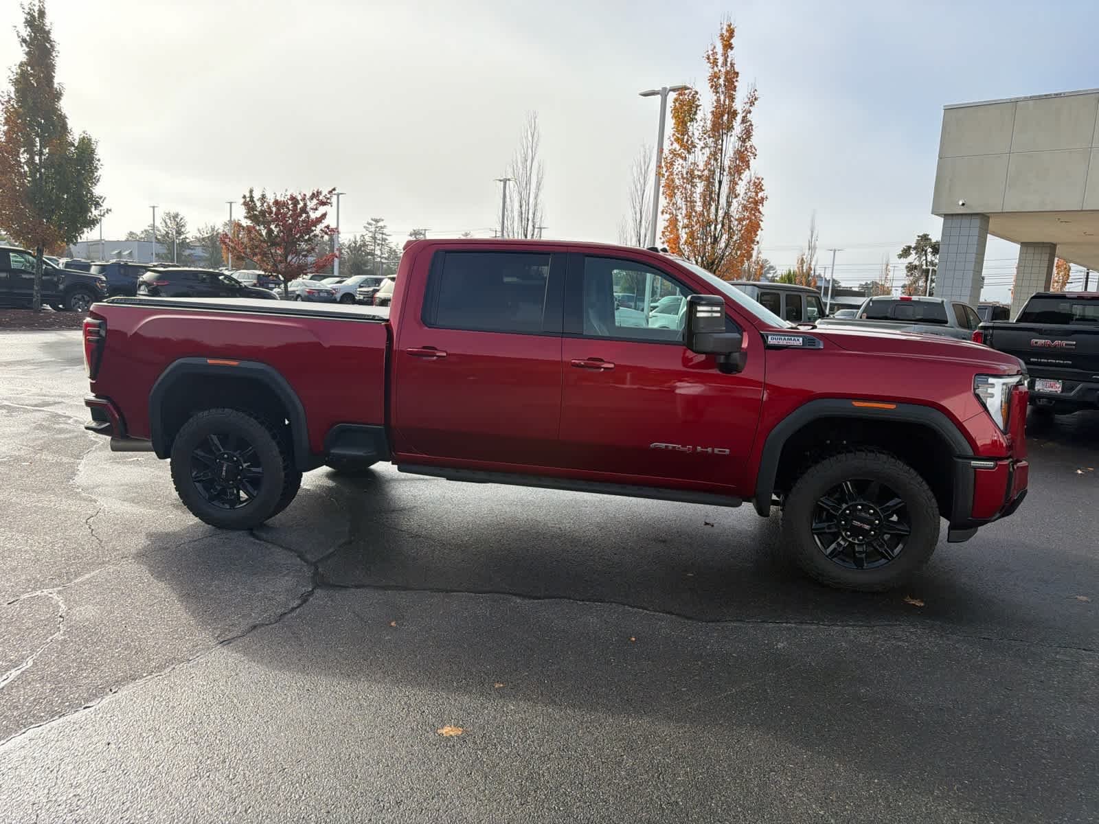 Used 2025 Volcanic Red Tintcoat GMC AT4 image 7