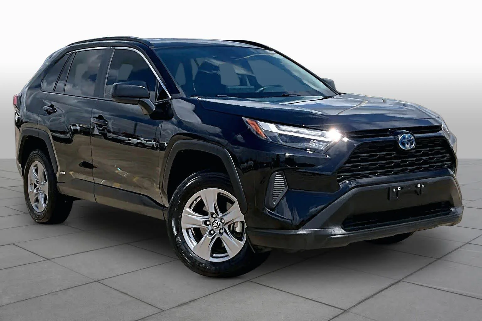 Used 2024 Midnight Black Metallic Toyota Hybrid LE image 3