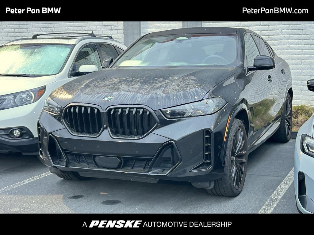 Certified Used 2024 Black Sapphire Metallic BMW xDrive40i image 1