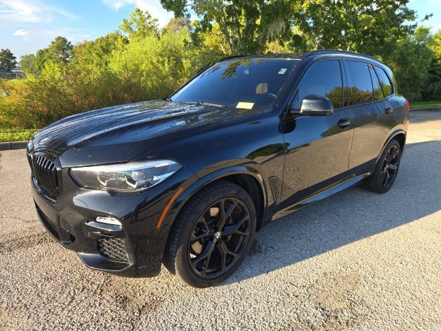 Used 2020 Black Sapphire Metallic BMW sDrive40i image 1