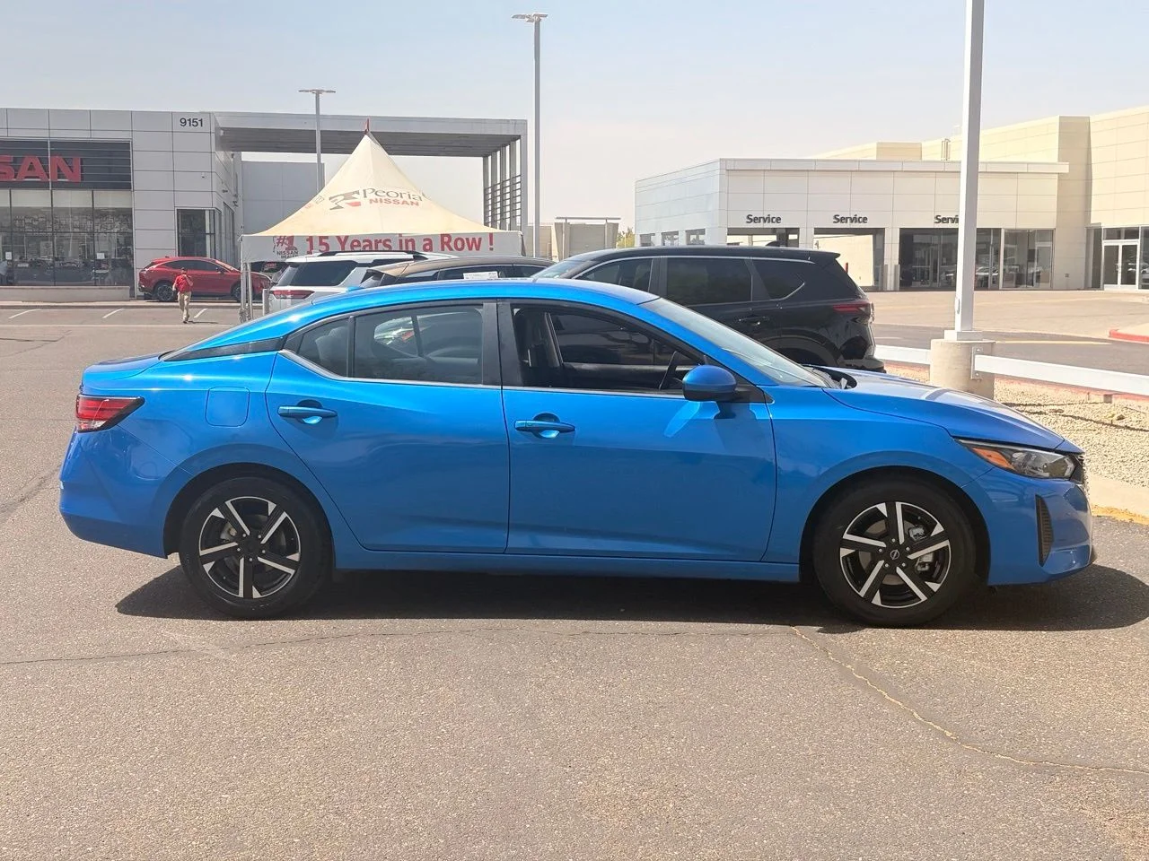 Used 2024 Electric Blue Metallic Nissan SV image 6