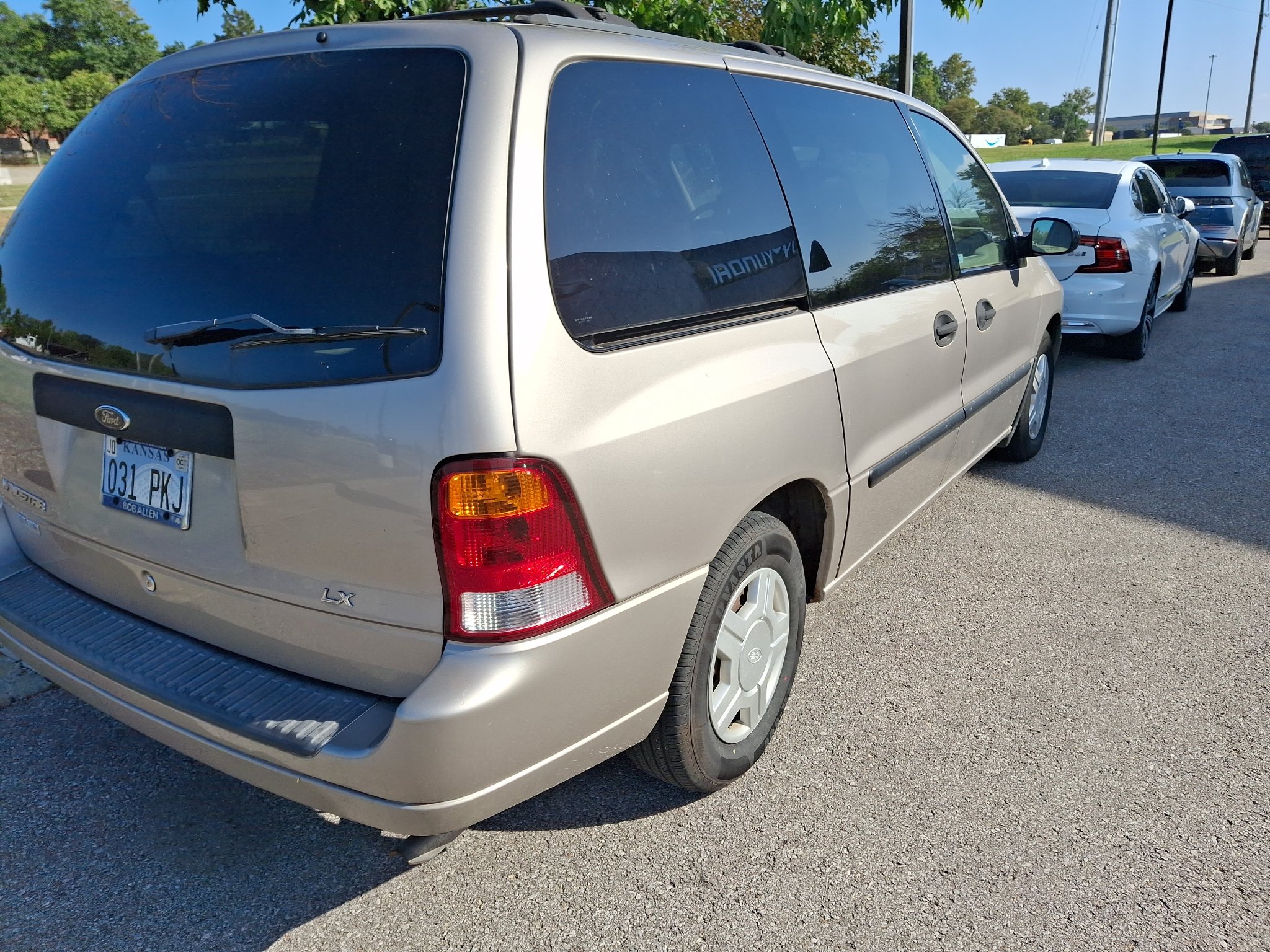 Used 2003 Silver Frost Clearcoat Metallic Ford LX image 2