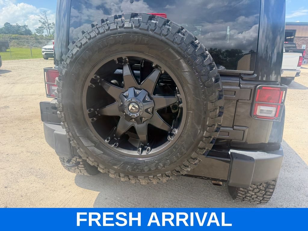 Used 2015 Black Jeep Unlimited Sahara Altitude image 2