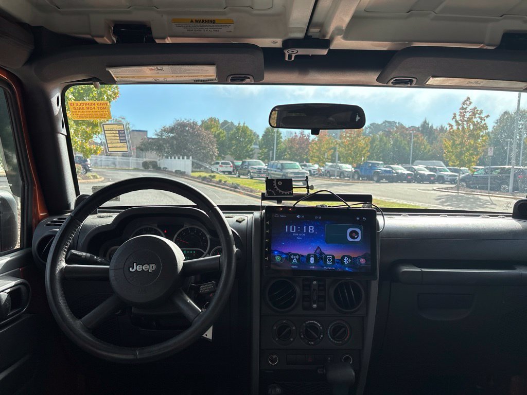 Used 2010 Orange Jeep Unlimited Sport image 10