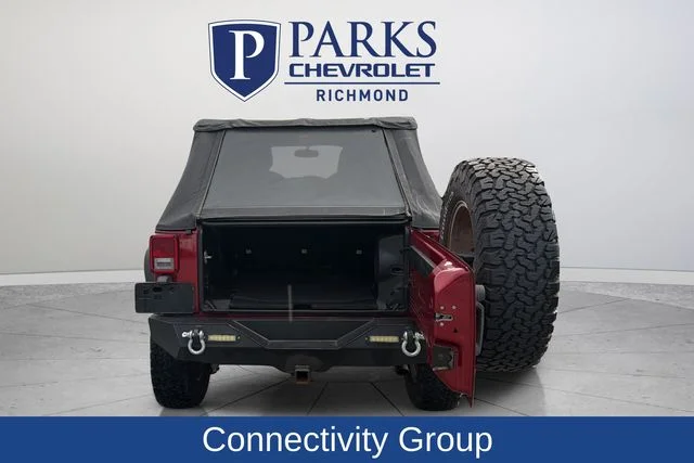 Used 2013 Red Jeep Unlimited Sahara image 9