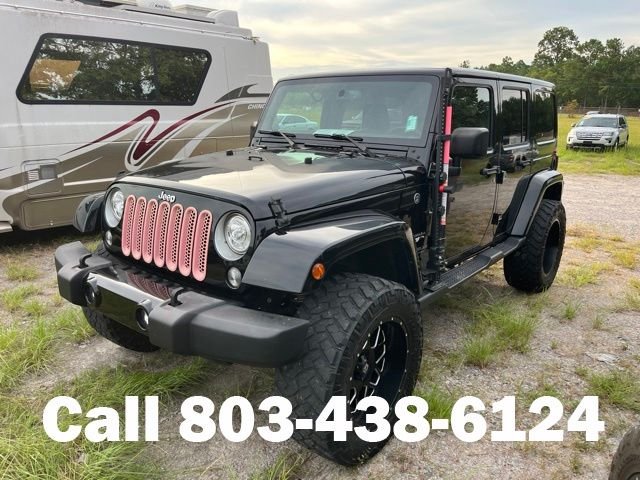 Used 2017 Black Jeep Unlimited Sahara image 4