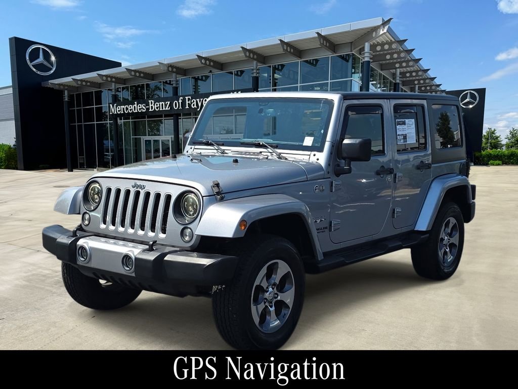 Used 2016 Silver Jeep Unlimited Sahara image 1