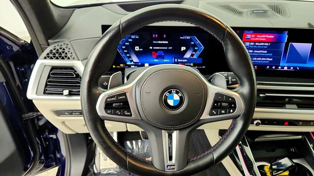 Used 2024 Tanzanite Blue II Metallic BMW M60i Sports Activity Vehicle image 14