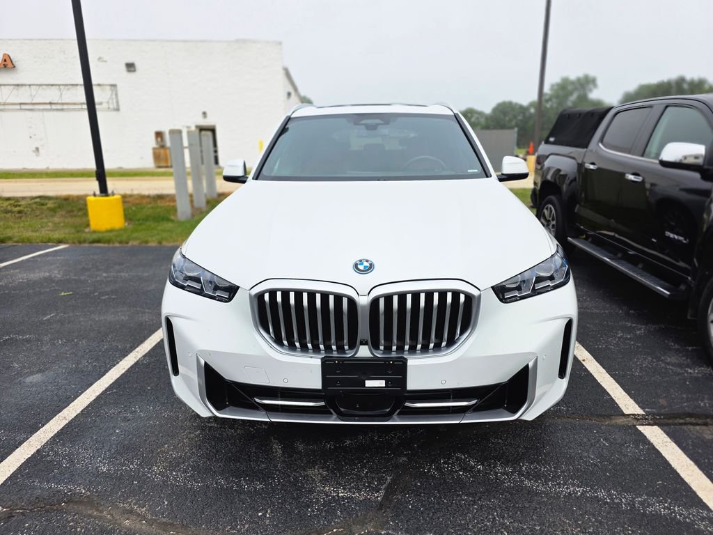 Used 2024 Mineral White Metallic BMW xDrive50e image 1