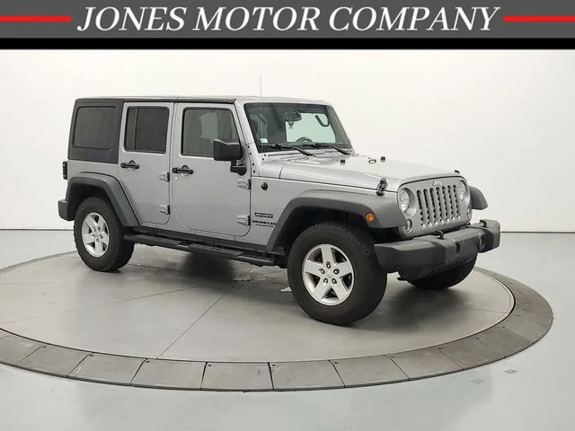 Used 2015 Silver Jeep Unlimited Sport image 1