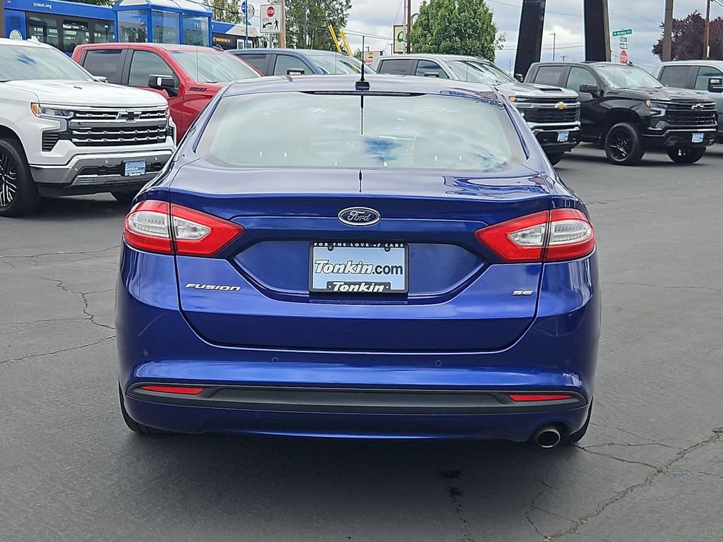 Used 2014 Blue Metallic Ford SE image 5