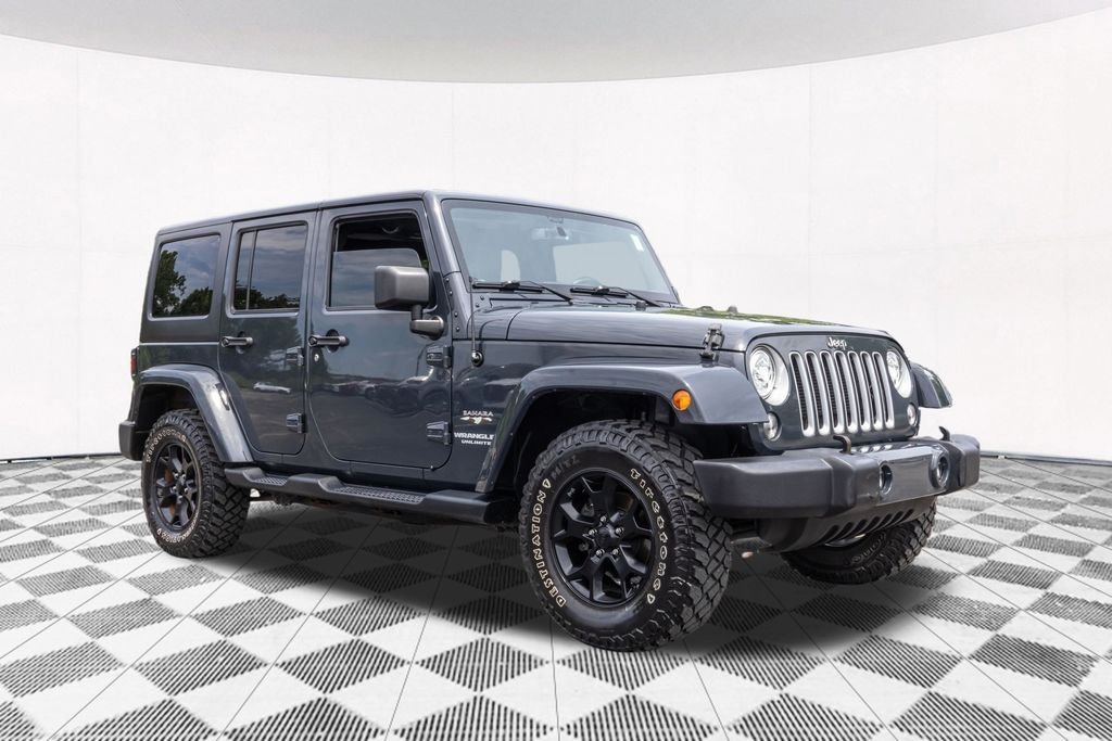 Used 2017 Black Jeep Unlimited Sahara image 12