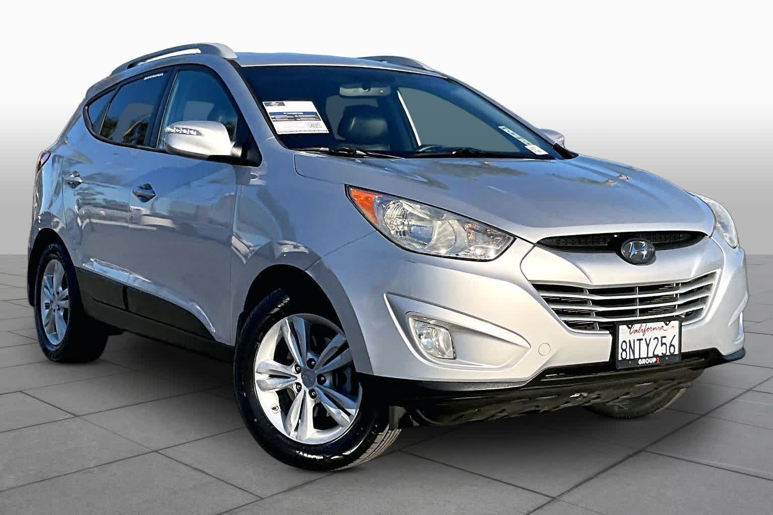 Used 2013 Hyundai Tucson GLS with VIN KM8JUCAC0DU562073 for sale in Newport Beach, CA