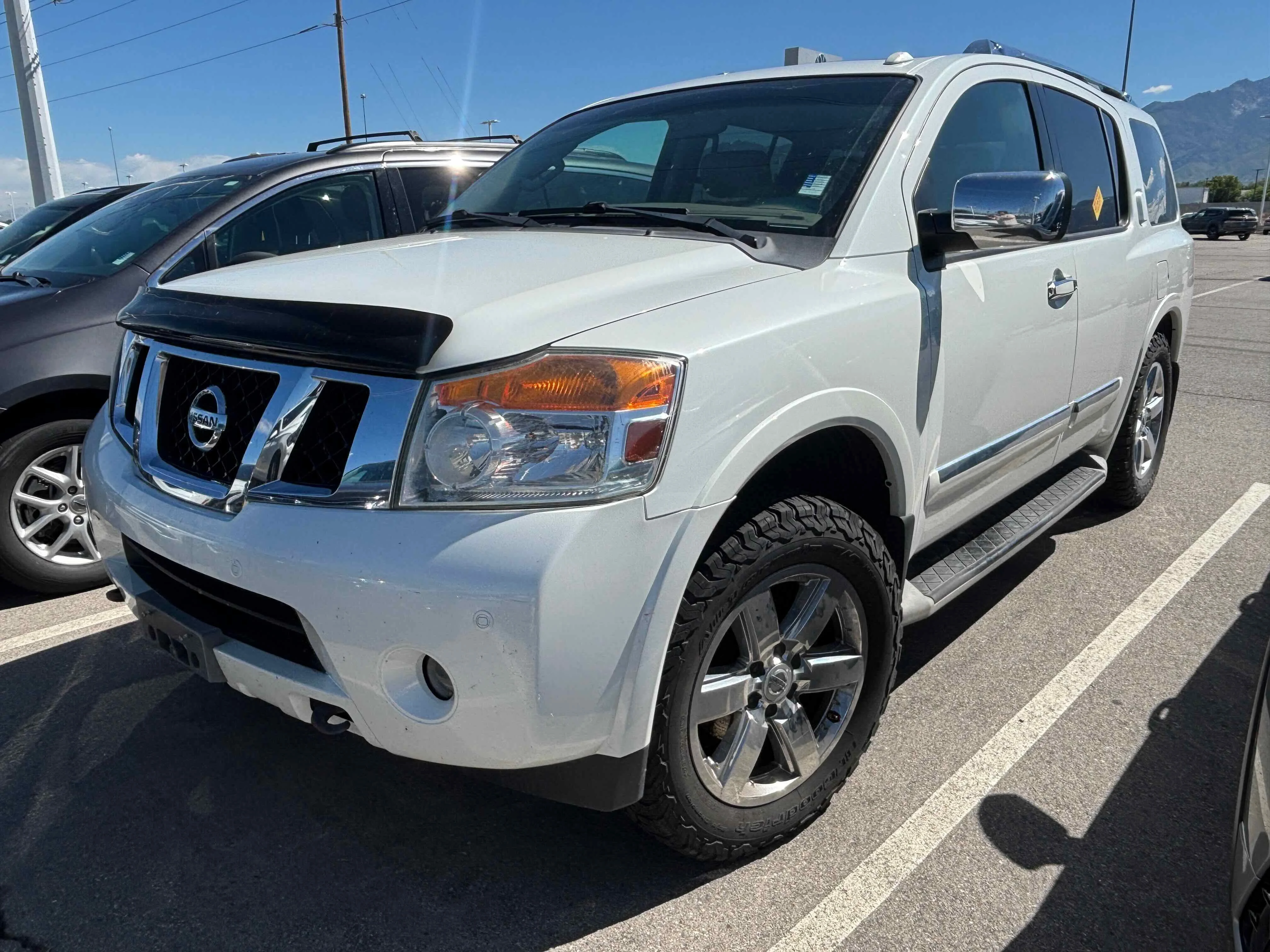 Used 2013 Pearl White Nissan Platinum image 1