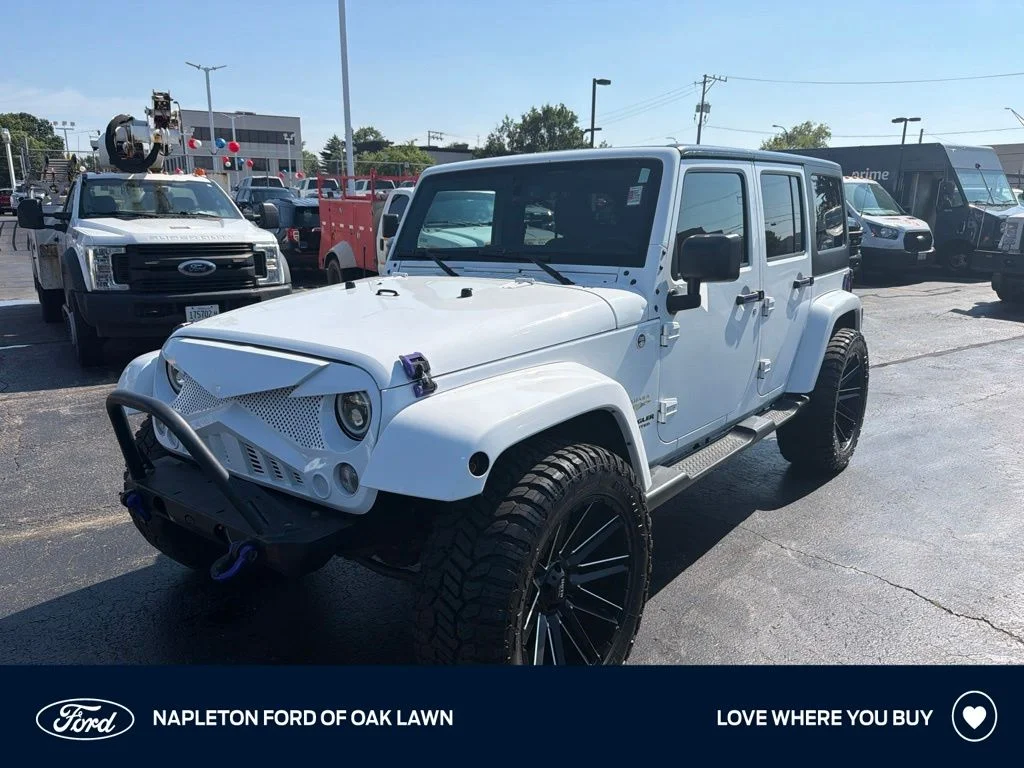 Used 2015 White Jeep Unlimited Sahara image 1