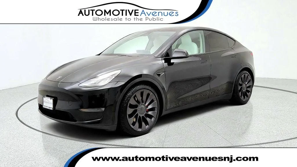 Used 2021 Solid Black Tesla Performance AWD w/ White & Black Premium Interior image 1