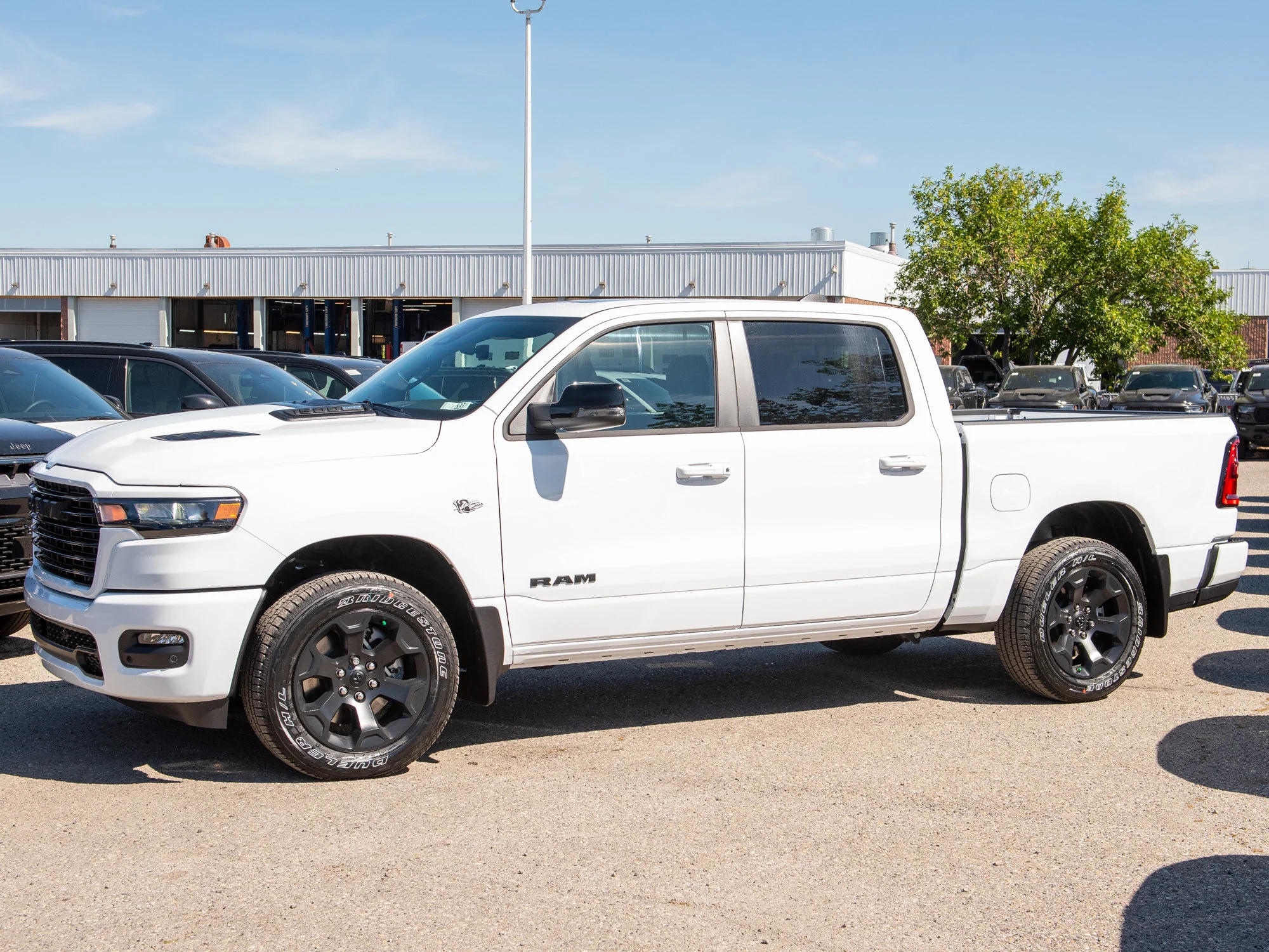 New 2026 White RAM Sport* Crew Cab 4x4, HEMI V8, Panoramic Sunroof, 3.92 Rear Axle, Heated Seats image 2