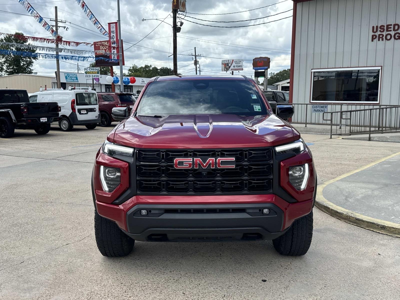 Used 2025 Volcanic Red Tintcoat GMC 2WD Elevation image 2