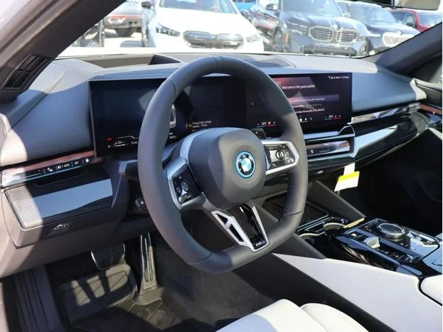 New 2026 Mineral White Metallic BMW 550e xDrive image 21