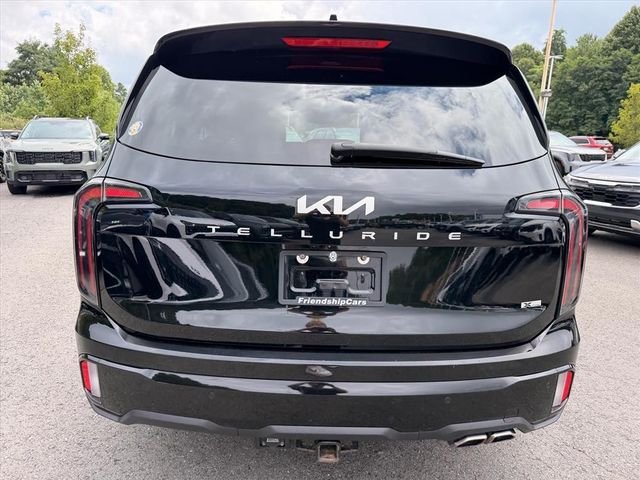 Used 2024 Black Kia EX X-Line image 13