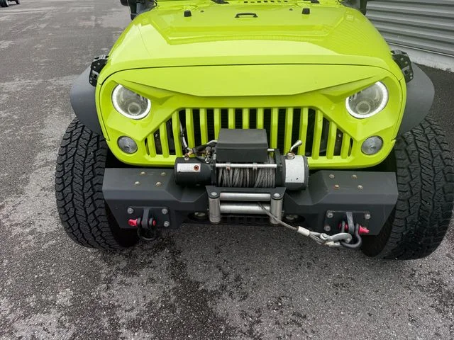 Used 2017 Green Jeep Unlimited Sport image 4