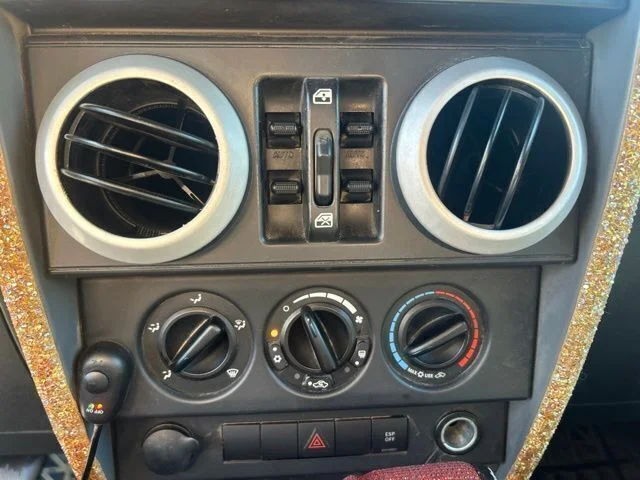 Used 2009 Orange Jeep Unlimited Sahara image 10