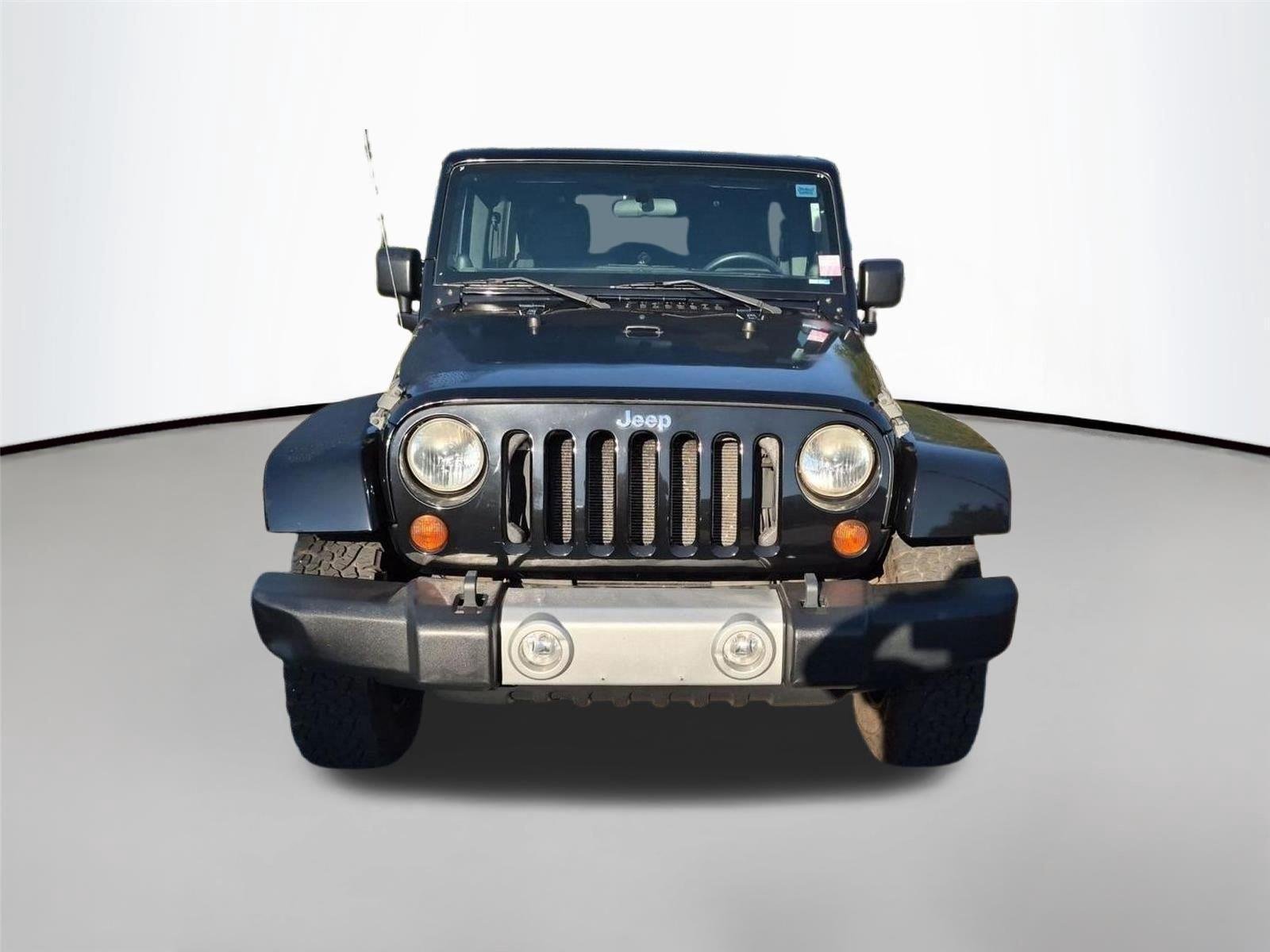 Used 2011 Black Clear Coat Jeep Sahara image 7