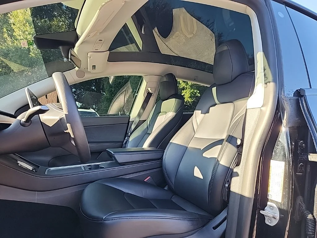 Used 2022 Solid Black Tesla Performance image 2