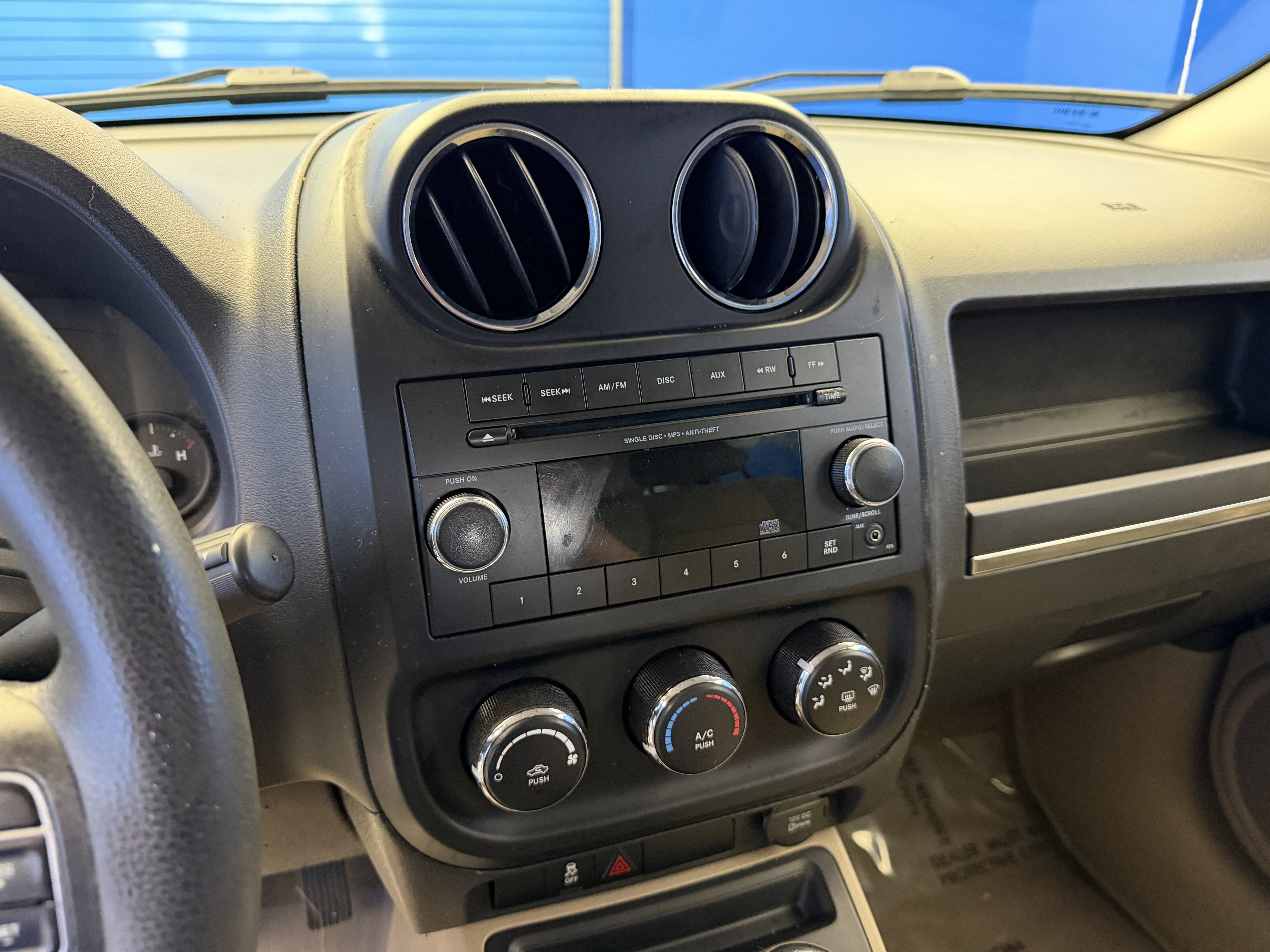 Used 2012 Mineral Gray Metallic Jeep Sport image 16