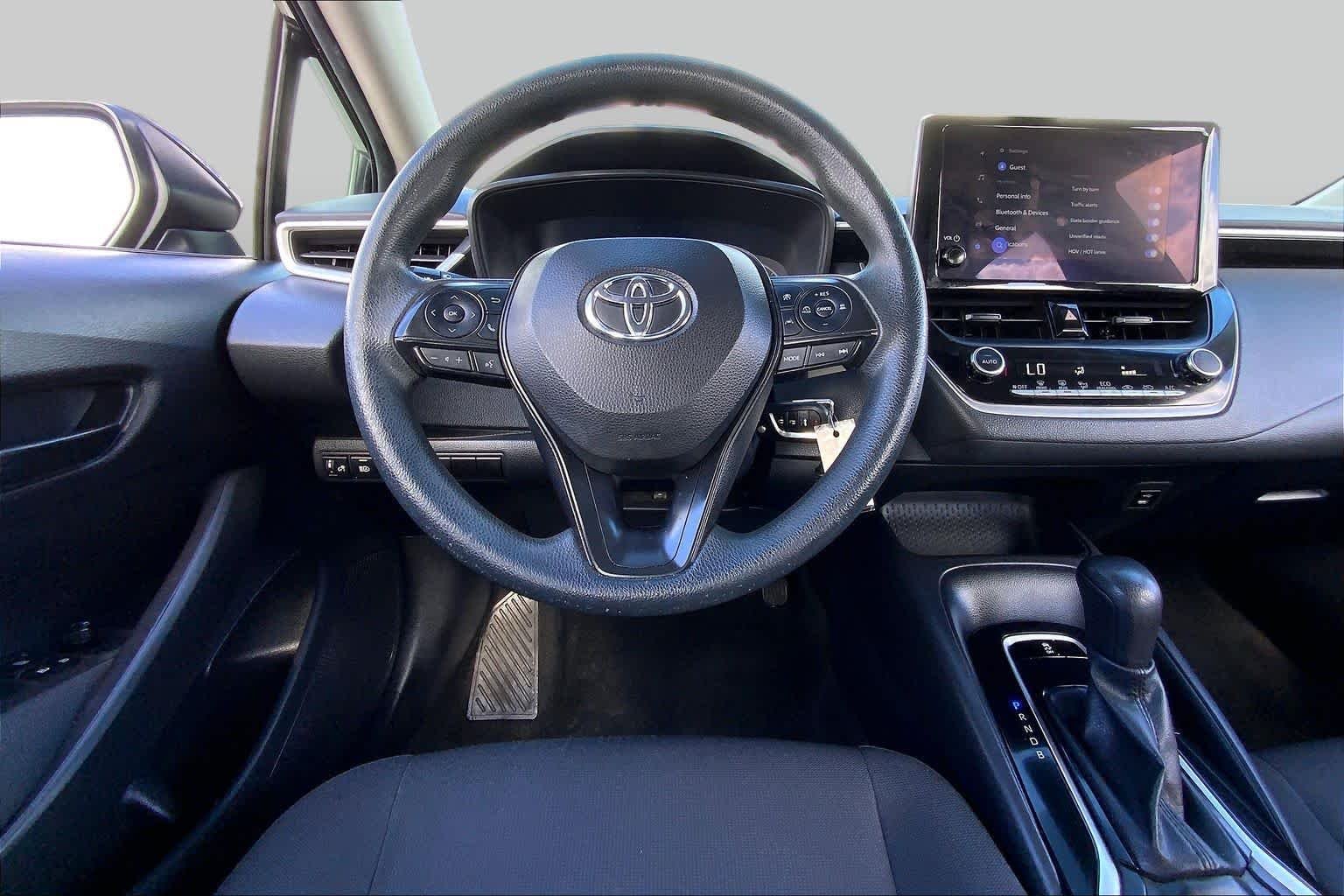 Used 2023 Midnight Black Metallic Toyota LE image 6