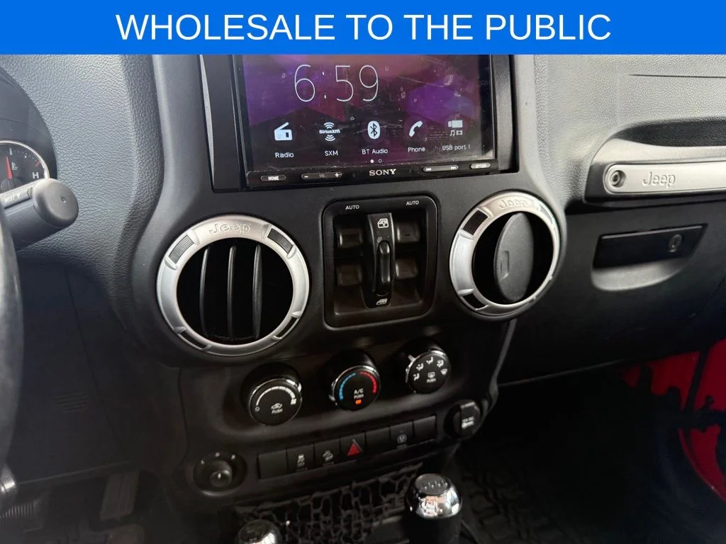 Used 2016 Red Jeep Unlimited Sahara image 14