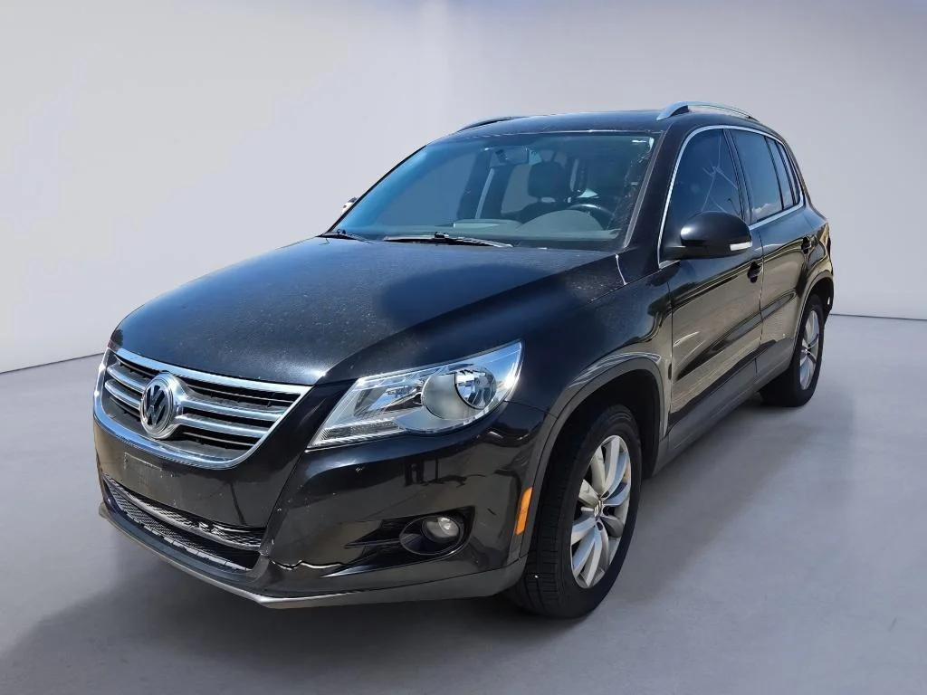 Used 2011 Deep Black Metallic Volkswagen SE 4Motion image 1