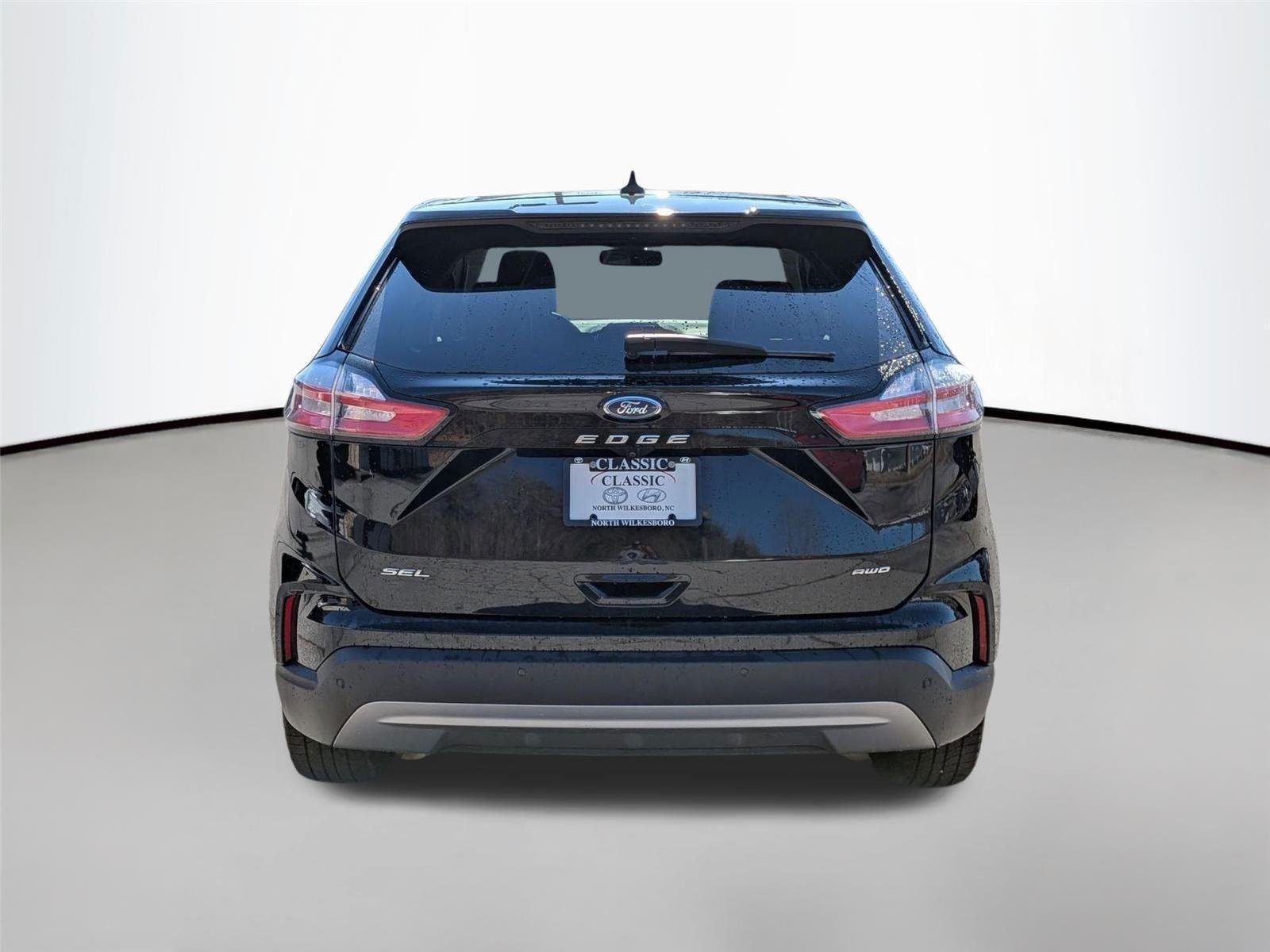 Used 2023 Agate Black Metallic Ford SEL image 6