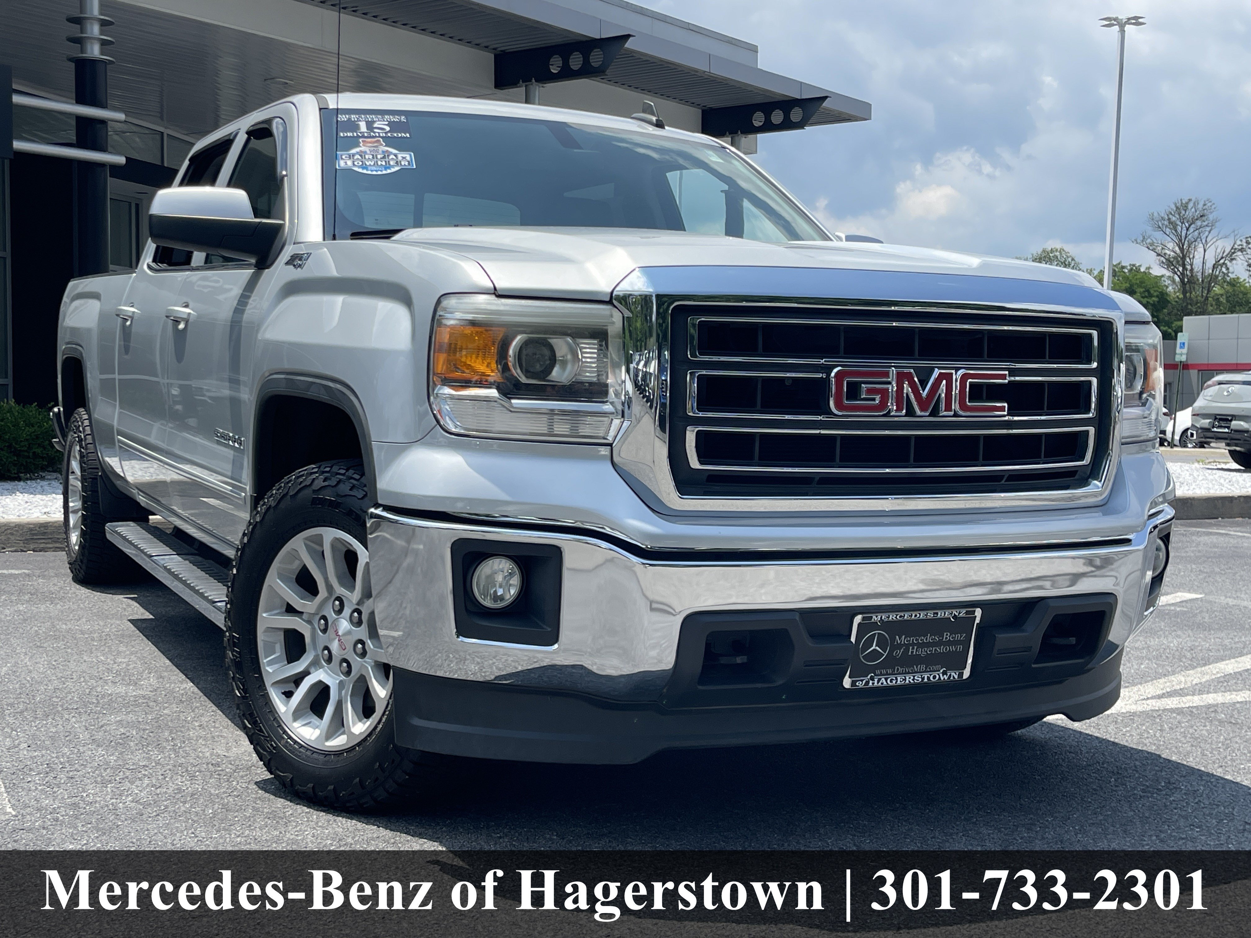 Used 2015 Quicksilver Metallic GMC SLE 4WD Crew Cab 153.0 image 1