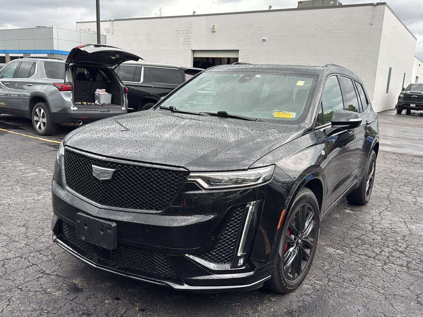 Used 2023 Stellar Black Metallic Cadillac AWD Sport image 2