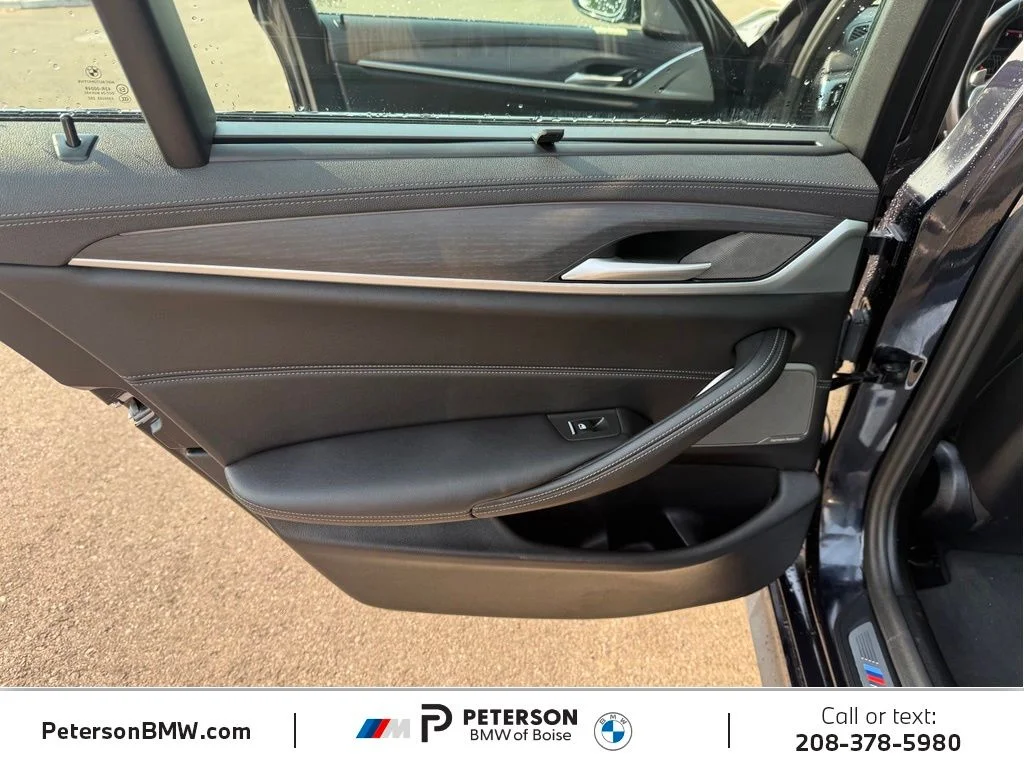 Used 2023 Black BMW M550i xDrive image 16