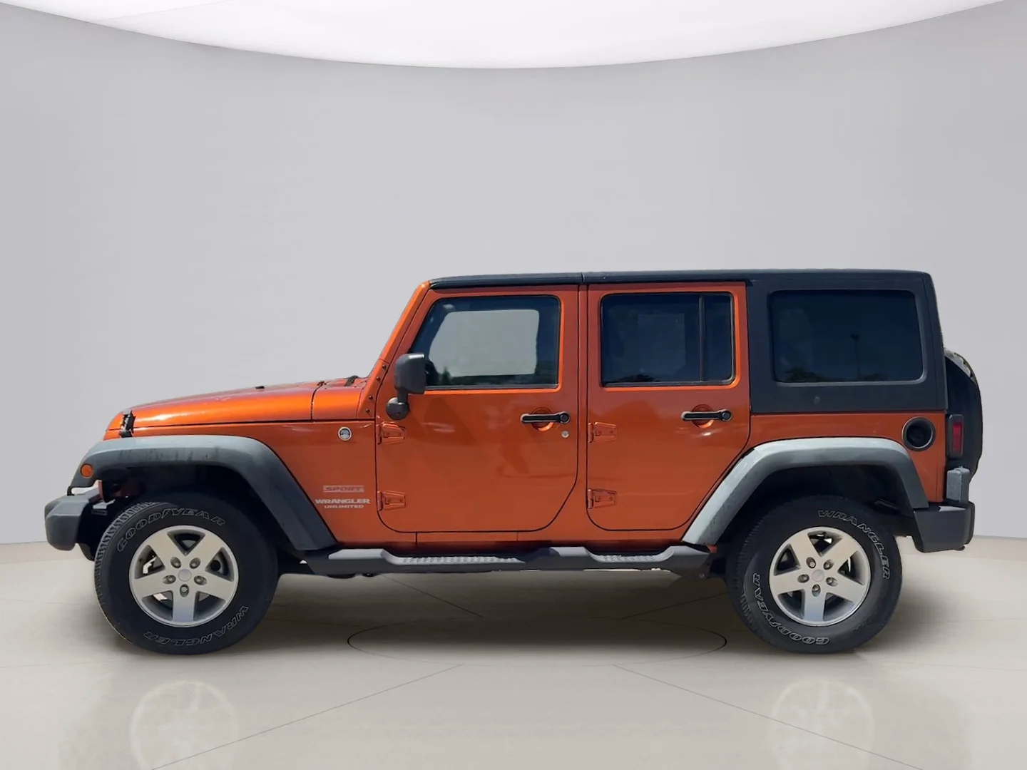 Used 2011 Orange Jeep UNLIMITED image 2