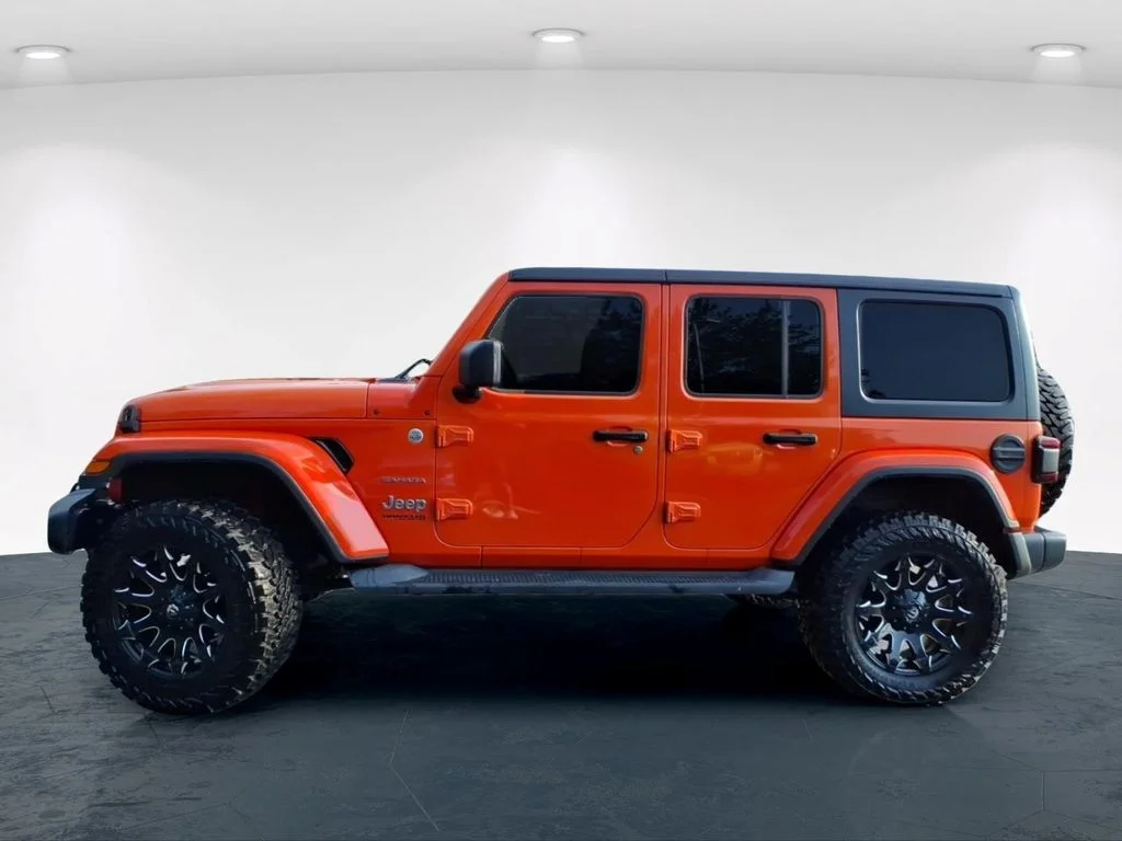 Used 2018 Orange Jeep Unlimited Sahara image 11