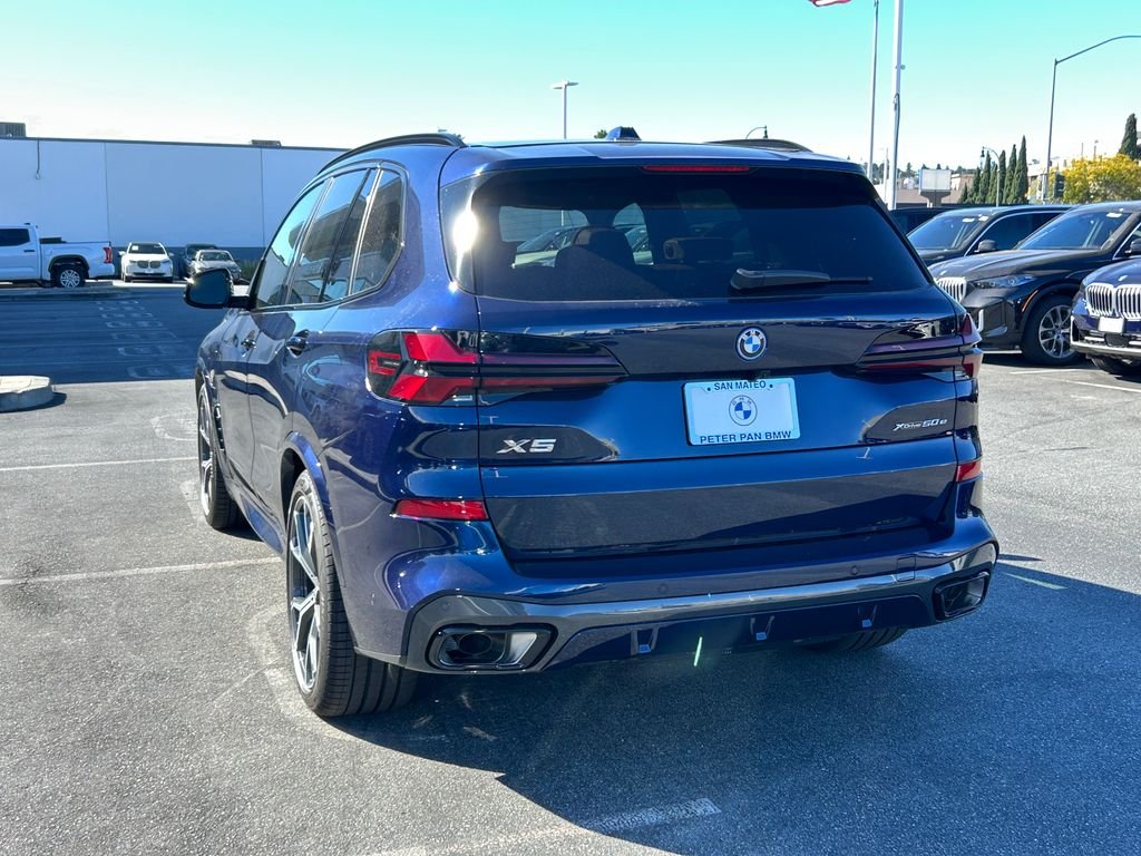 New 2026 Tanzanite Blue II Metallic BMW xDrive50e image 3