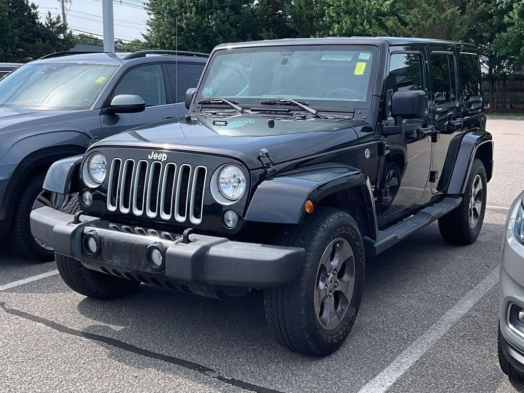 Used 2016 Black Jeep Unlimited Sahara image 3