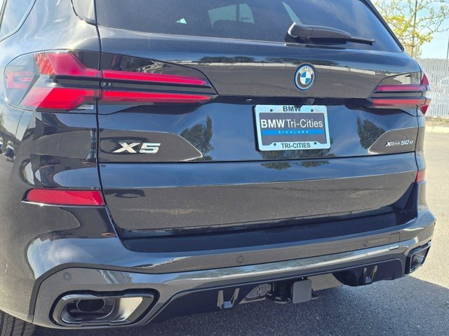 New 2026 Black Sapphire Metallic BMW xDrive50e image 7